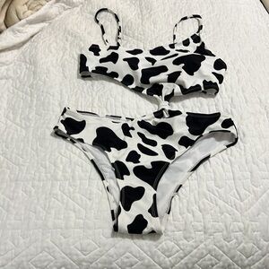 NWOT Black and white asymmetric swimsuit size L.